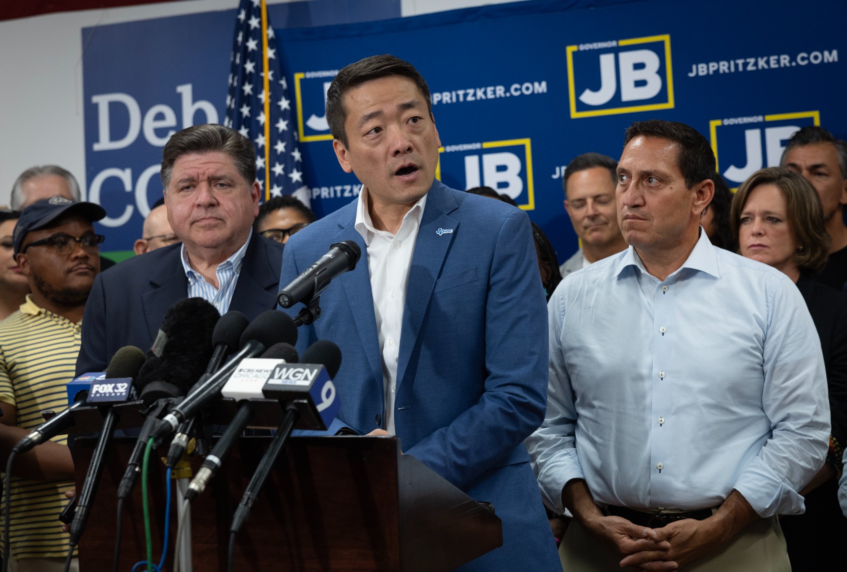 Illinois Governor JB Pritzker (L) and Texas Rep. Trey Martinez Fischer (R) listen as Texas House Democratic Caucus Chair Gene Wu speaks to reporters during a press conference at the DuPage County Democratic Party headquarters on August 03, 2025 in Carol Stream, Illinois. (Scott Olson/Getty Images)