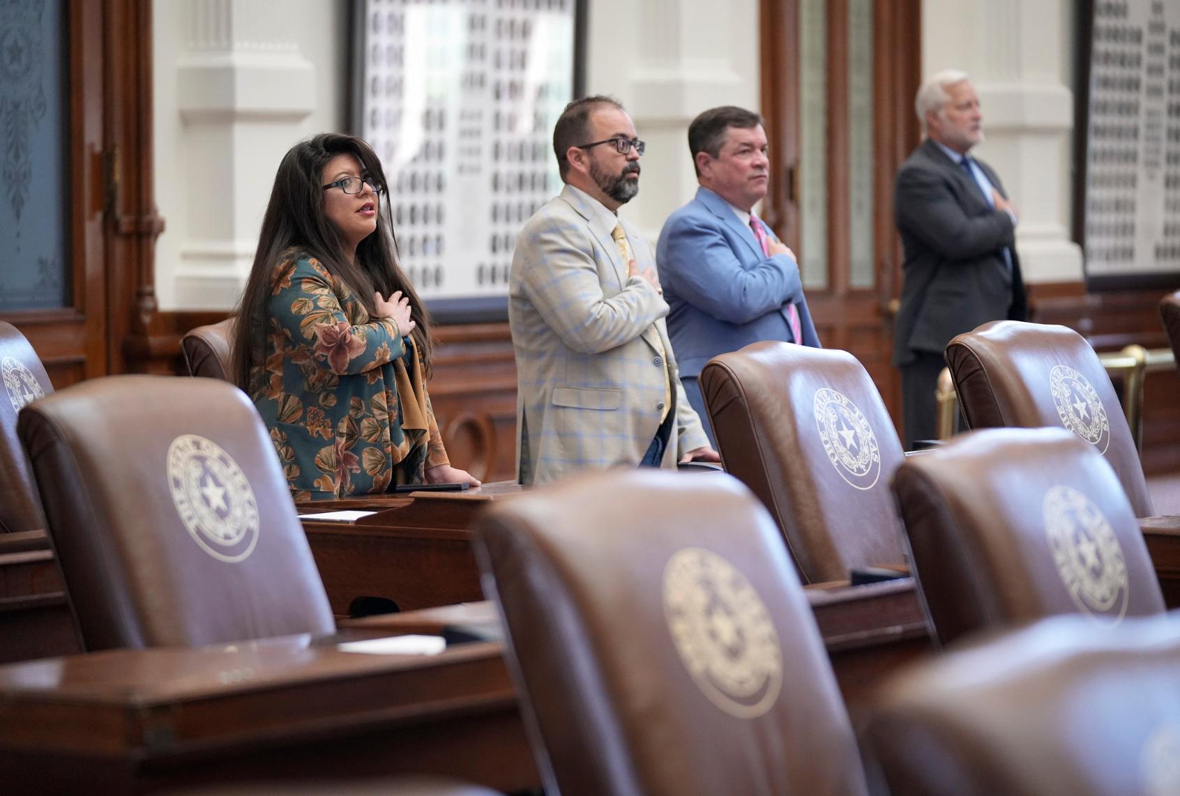 Rep. Mary Gonzalez, D-Clint, Rep. Joe Moody, D-El Paso, and Rep King King, R-Canadian, stand for the Pledge of Allegiance in the House Chamber at the Capitol in Austin, Friday, Aug. 8, 2025. (Jay Janner/Austin American-Statesman via Getty Images))