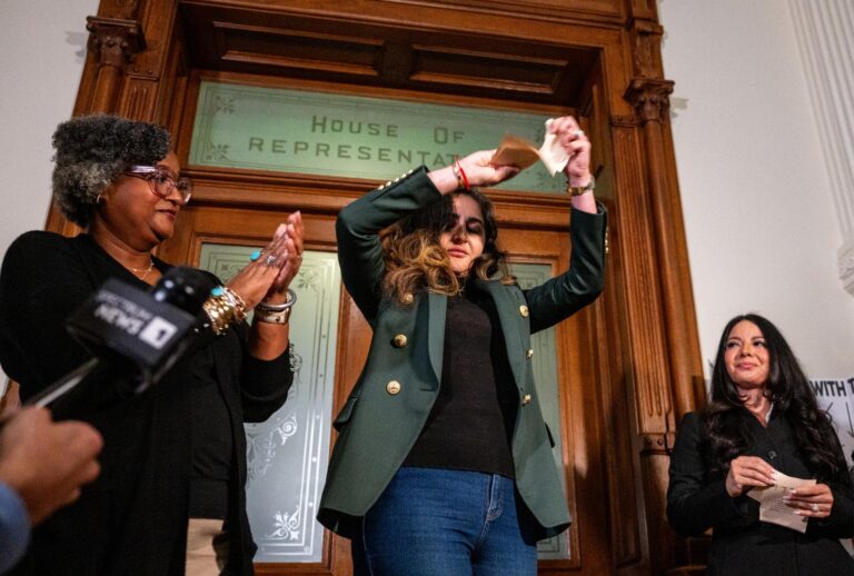 Democratic Texas Rep. Mihaela Plesa tears her Department of Public Safety escort form during a news conference outside of the House chamber in the State Capitol on August 19, 2025 in Austin, Texas. (Brandon Bell/Getty Images)