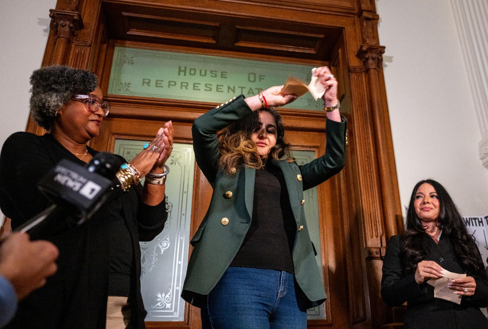 Democratic Texas Rep. Mihaela Plesa tears her Department of Public Safety escort form during a news conference outside of the House chamber in the State Capitol on August 19, 2025 in Austin, Texas. (Brandon Bell/Getty Images)
