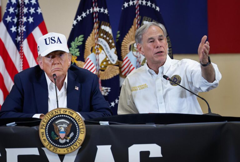 President Donald Trump and Texas Governor Greg Abbott participate in a round table event at the Hill Country Youth Event Center to discuss last week's flash flooding on July 11, 2025 in Kerrville, Texas. (Chip Somodevilla/Getty Images)