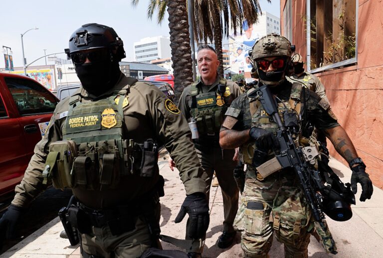 Gregory Bovino, Chief Patrol Agent of the El Centro Sector and Commander-Operation At Large CA (center), marches with federal agents to the Edward R. Roybal Federal Building on Aug. 14, 2025. (Carlin Stiehl / Los Angeles Times via Getty Images)