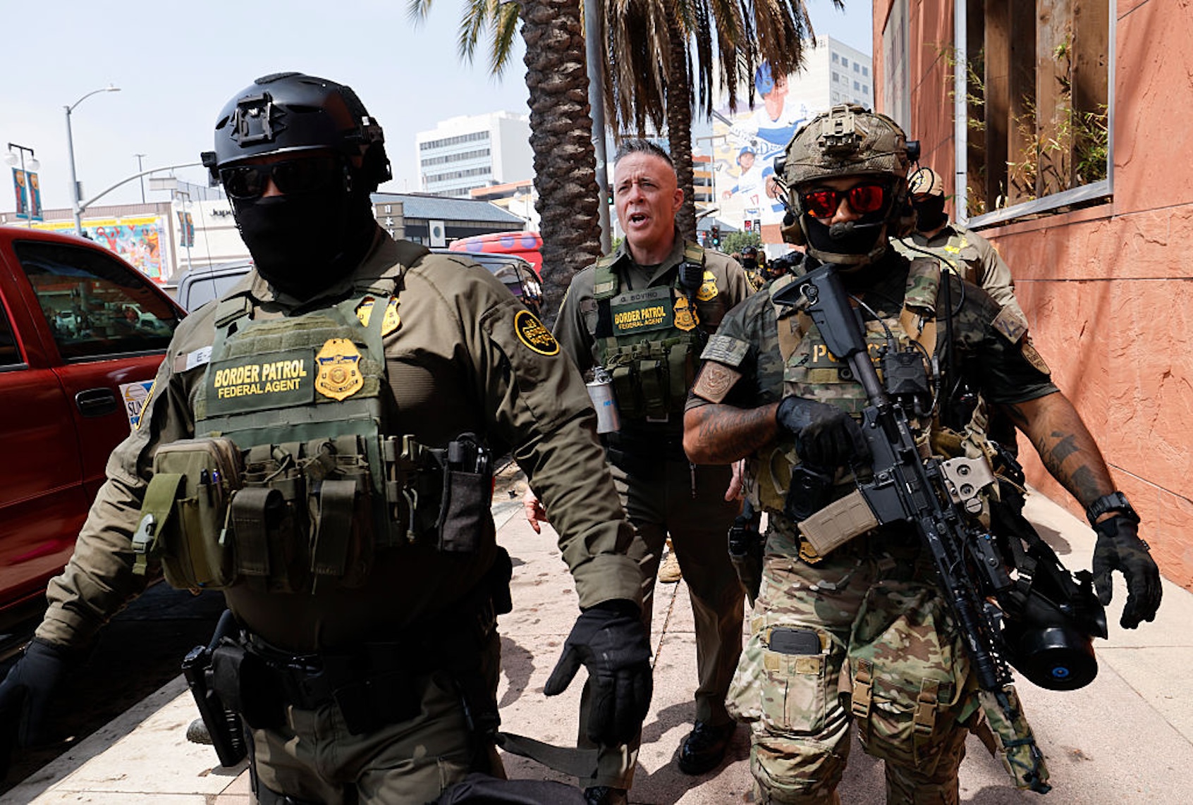 Gregory Bovino, Chief Patrol Agent of the El Centro Sector and Commander-Operation At Large CA (center), marches with federal agents to the Edward R. Roybal Federal Building on Aug. 14, 2025. (Carlin Stiehl / Los Angeles Times via Getty Images)