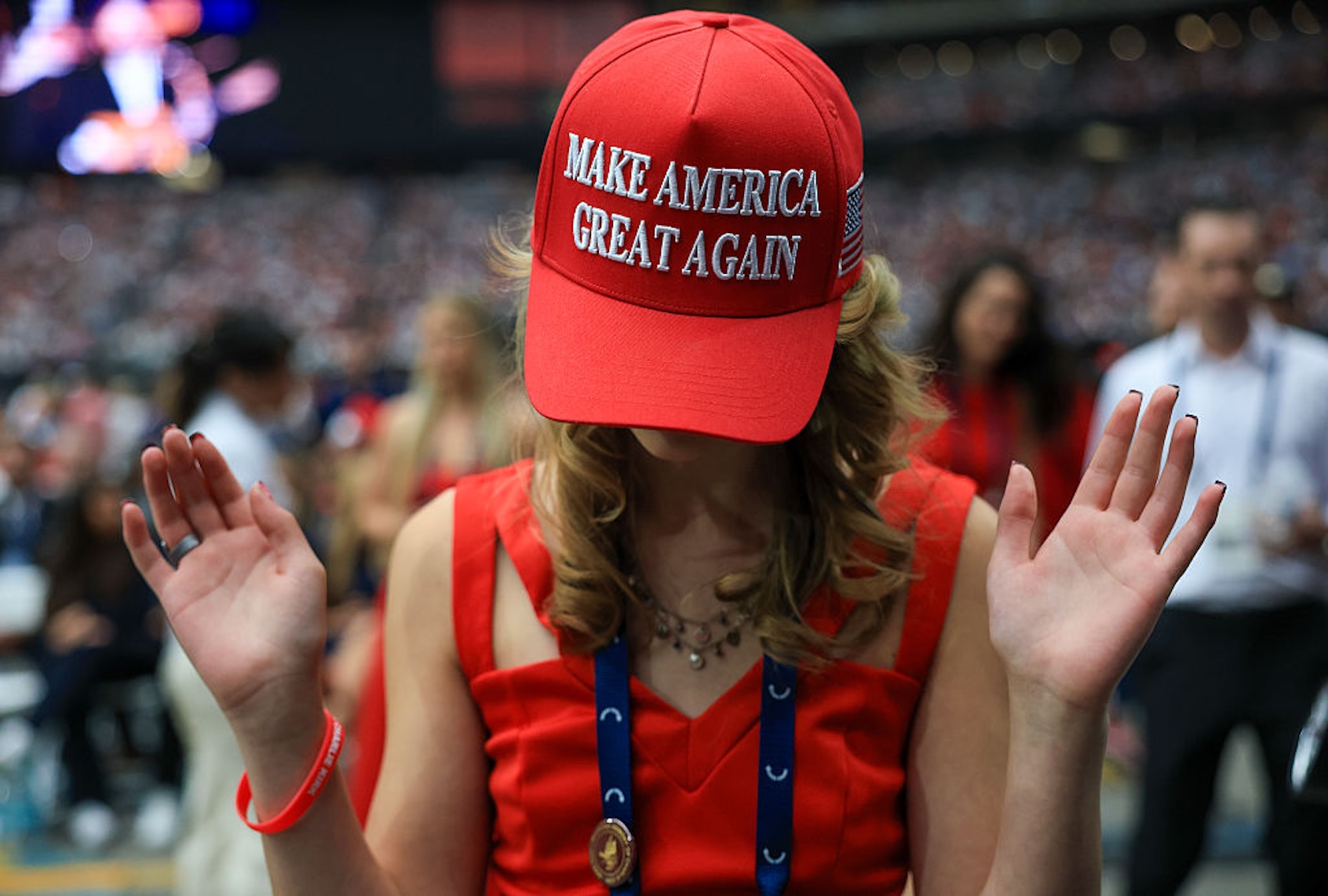 An attendee prays at the memorial service for political activist Charlie Kirk at State Farm Stadium on Sept. 21, 2025 in Glendale, Ariz. (Joe Raedle/Getty Images)