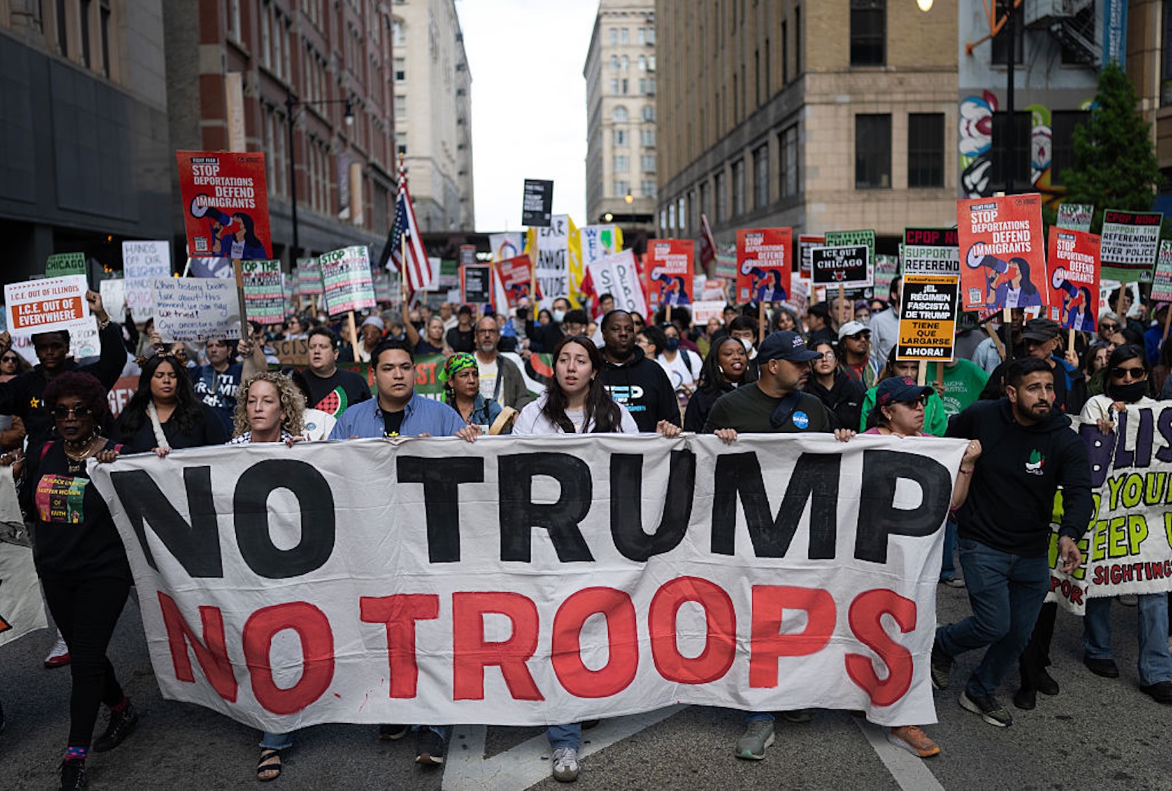 Demonstrators march through downtown Chicago to protest President Donald Trump's threats against the city. (Scott Olson/Getty Images)
