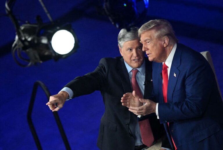Donald Trump chats with Fox News host Sean Hannity following a town hall on Sept. 4, 2024. (MANDEL NGAN/AFP via Getty Images)