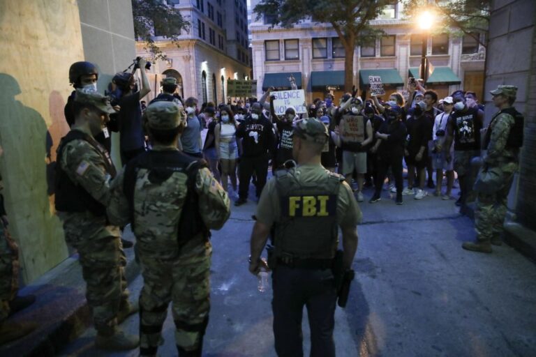 The FBI worked with local and federal authorities during the 2020 protests in reponse to George Floyd's murder. Now, FBI agents who knelt in solidarity are now losing their jobs for being "political". (Yasin Ozturk / Anadolu Agency / Getty Images)