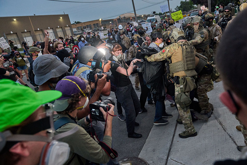 Federal agents face off with Anti-ICE protesters in Chicago. Local politicians are calling out the excessive and violent tactics of ICE agents. (DOMINIC GWINN / Contributor / Getty Images)