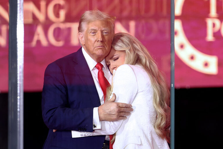 President Trump hugs Erika Kirk to close out the lengthy memorial service for her husband, controversial conservative activist Charlie Kirk on Sunday. (CHARLY TRIBALLEAU / Getty Images)