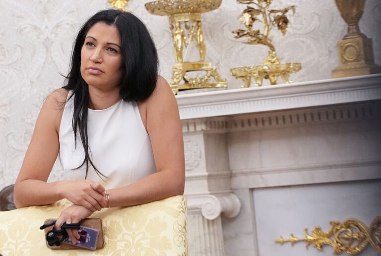 Katie Miller listens as President Donald Trump and Tesla CEO Elon Musk speak to reporters in the Oval Office on May 30, 2025. (Kevin Dietsch/Getty Images)