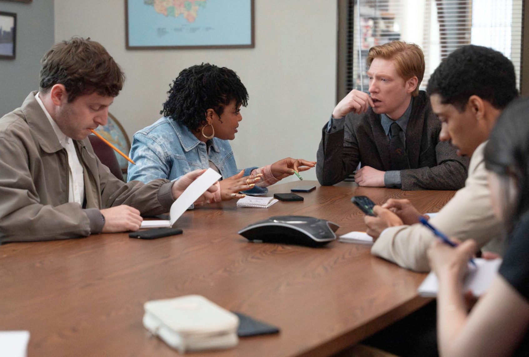 (l-r) Alex Edelman as Adam, Gbemisola Ikumelo as Adelola, Domhnall Gleeson as Ned and Melvin Gregg as Detrick in "The Paper" (Aaron Epstein/Peacock)