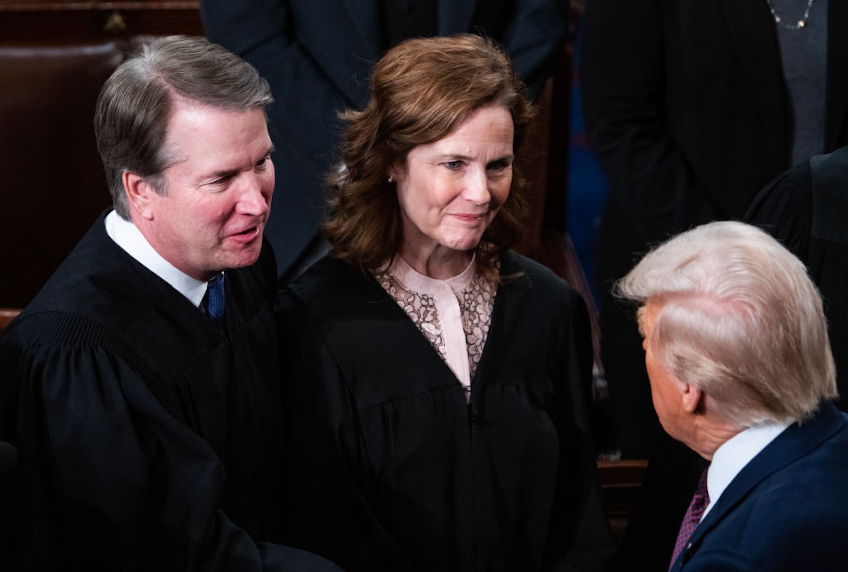 Supreme Court Justices Brett Kavanaugh and Amy Coney Barrett greet President Donald Trump after his address to a joint session of Congress on March 4, 2025. (Tom Williams/CQ-Roll Call, Inc via Getty Images)