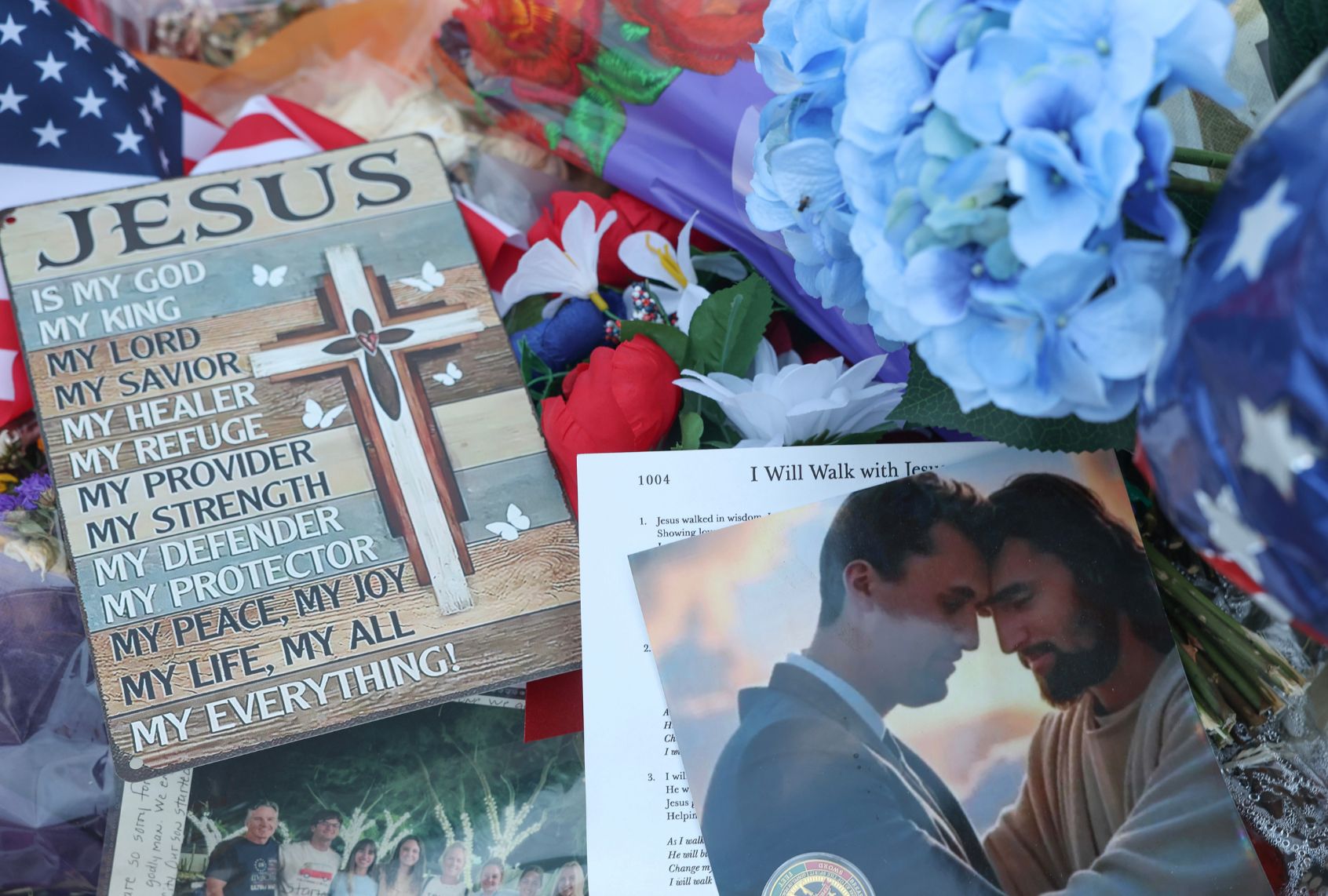 Items are displayed in the makeshift memorial for Charlie Kirk outside the headquarters of Turning Point USA on September 18, 2025, in Phoenix, Arizona. (Joe Raedle/Getty Images)