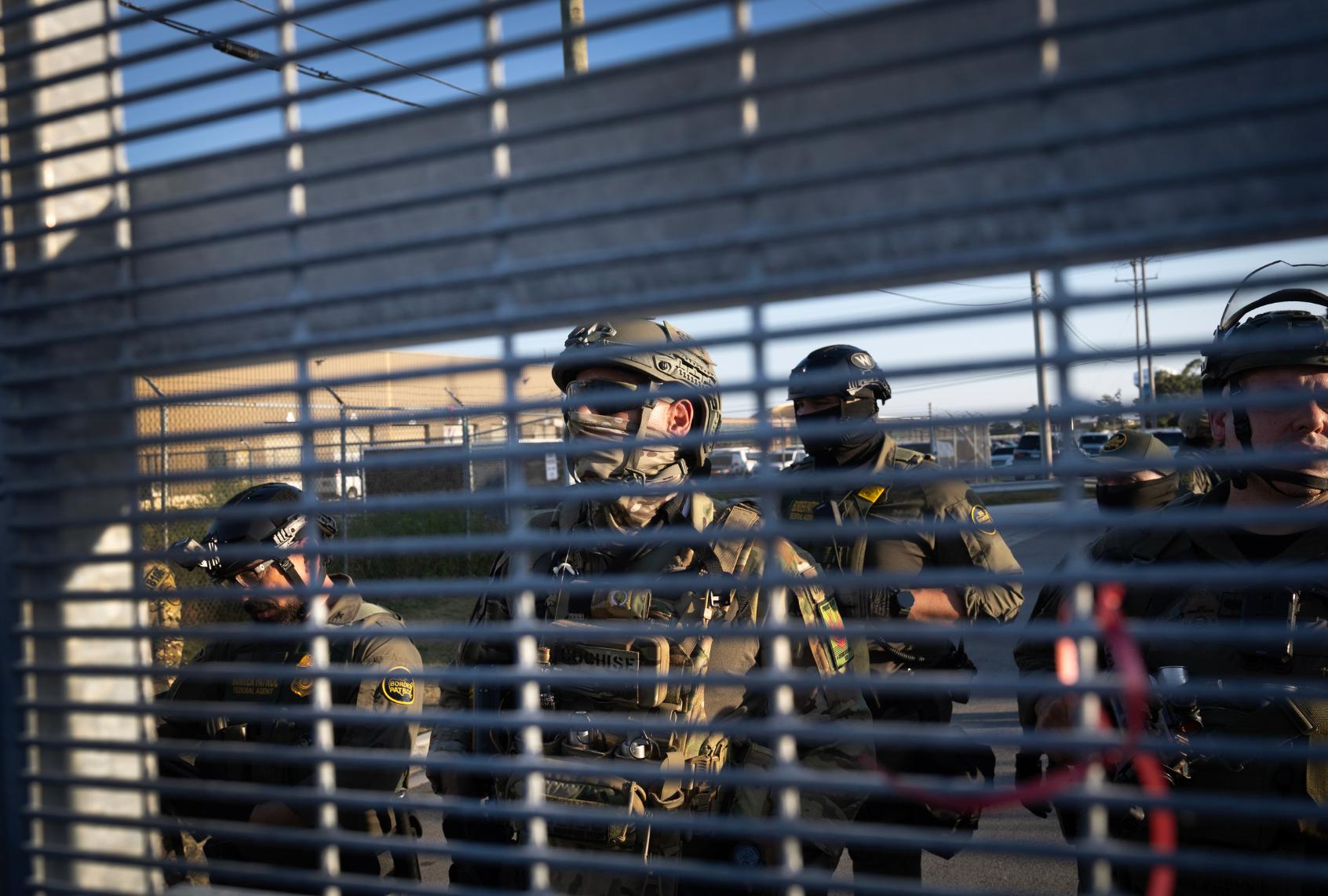 Federal law enforcement agents confront demonstrators protesting outside of an immigrant processing center on September 27, 2025 in Broadview, Illinois. (Scott Olson/Getty Images)