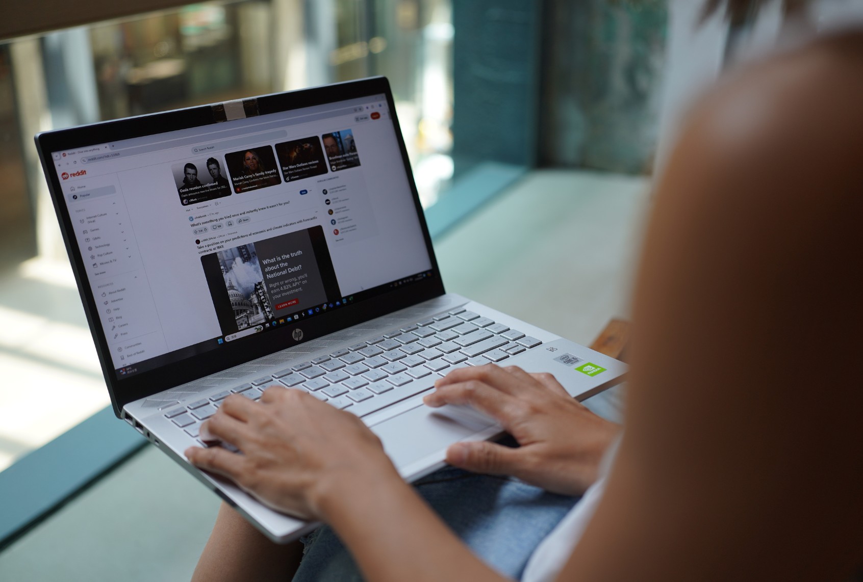 In this photo illustration, a woman browses Reddit website on her laptop. (Photo Illustration by Serene Lee/SOPA Images/LightRocket via Getty Images)