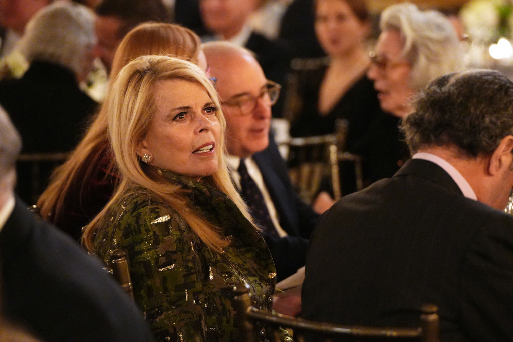 Betsy McCaughey sits at a dinner table among other guests during the American Austrian Foundation’s Music for Medicine event in New York City.
