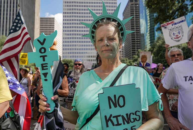 HOUSTON, TEXAS - OCTOBER 18:  Julie Neuman, 58, joins hundreds gathered for the No Kings Protest in front of City Hall on Saturday, Oct. 18, 2025 in Houston. (Raquel Natalicchio/Houston Chronicle via Getty Images)
