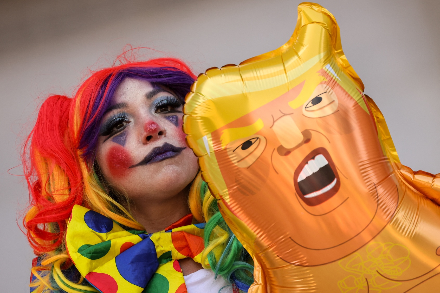 Demonstrator with a baby Trump balloon in front of City Hall in Los Angeles during “No Kings” protest, July 4, 2025. (Etienne Laurent/AFP via Getty Images)