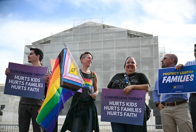 Demonstrators protest against conversion therapy outside  Supreme Court on Oct. 7, 2025. (ANDREW CABALLERO-REYNOLDS/AFP via Getty Images)