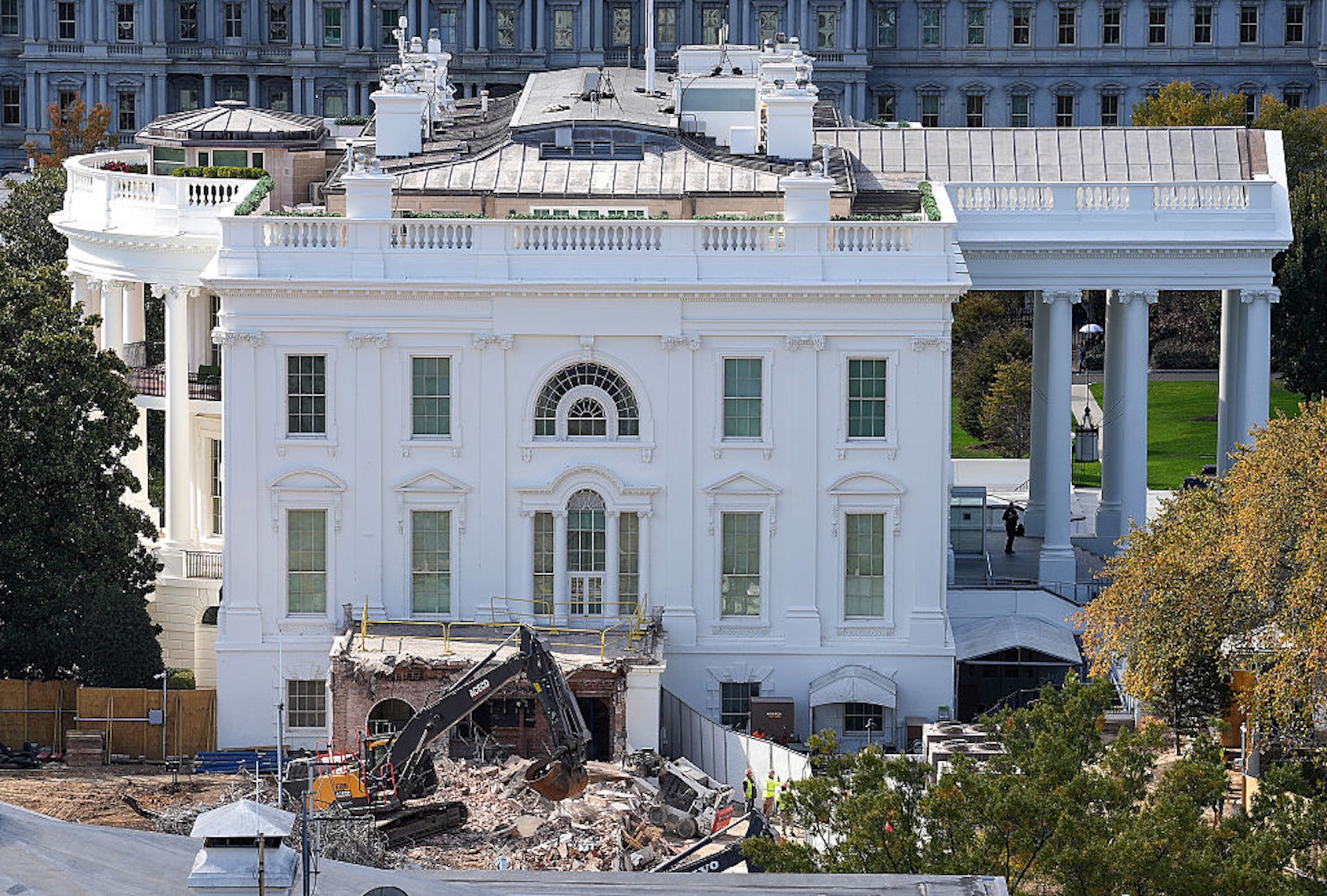 An excavator works to clear rubble after the East Wing of the White House was demolished on Oct. 23, 2025. (Eric Lee/Getty Images))