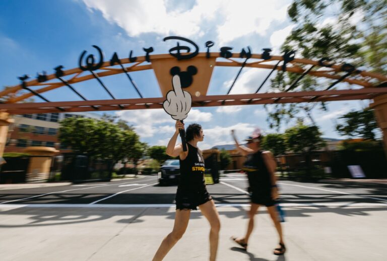 A person protesting outside the Walt Disney Studios in Burbank, Calif., on Sept. 19, 2025, after ABC suspended Jimmy Kimmel Live! (DAVID PASHAEE/Middle East Images/AFP via Getty Images)