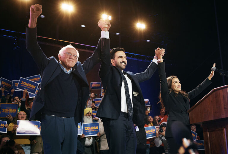 New York Mayoral Candidate Zohran Mamdani, center, celebrates with Sen. Bernie Sanders (I-VT), left, and U.S. Rep. Alexandria Ocasio-Cortez (D-NY), right, during an election rally on October 26, 2025. (Andres Kudacki/Getty Images)