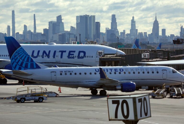 Professor targeted by MAGA tries to flee A United Airlines airplane and United Express jet sit parked at gates at Newark Liberty International Airport on June 1, 2025, in Newark, New Jersey. (Gary Hershorn/Getty Images)