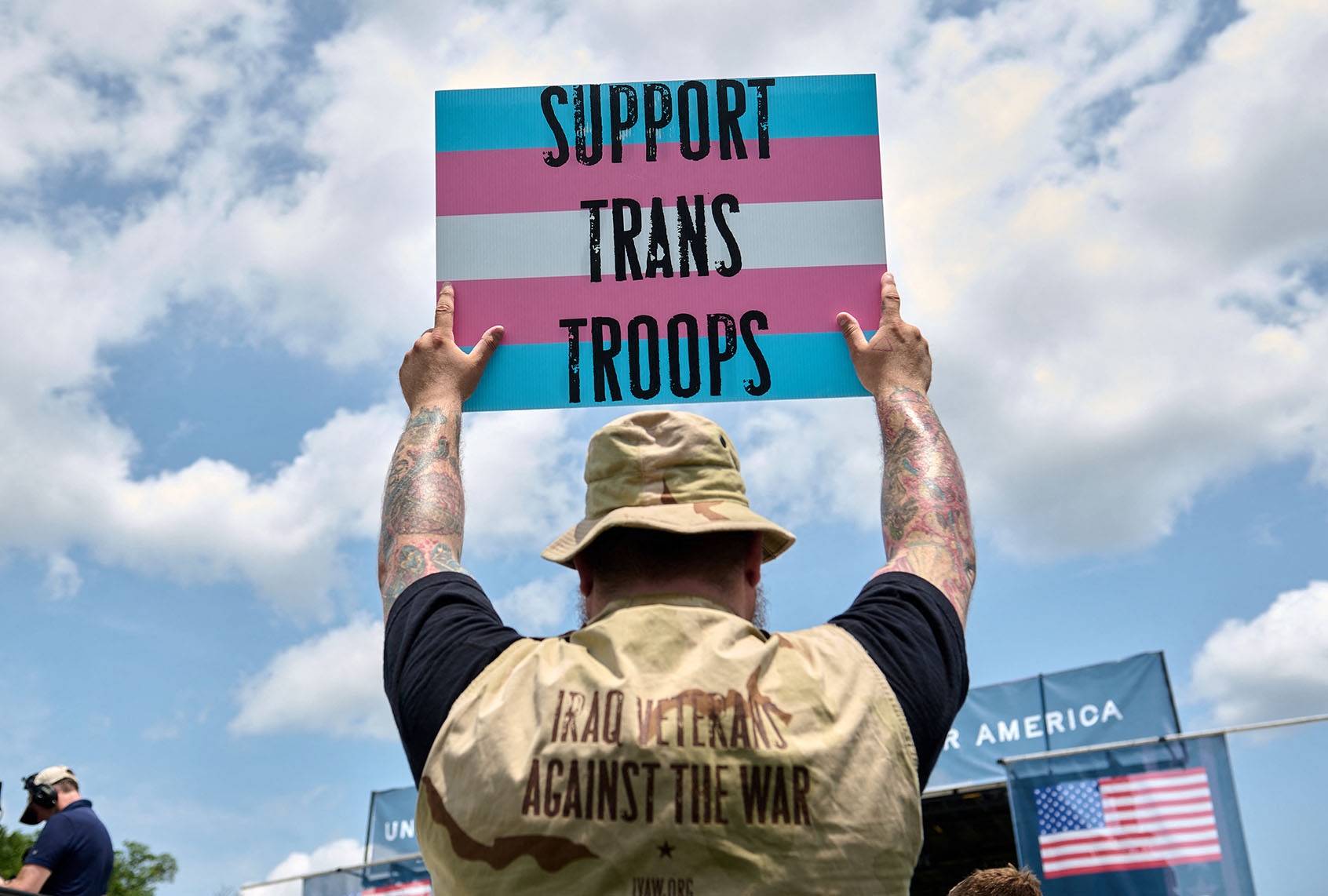 A person holds a sign in support of transgender service members during the Unite for Veterans rally on the National Mall in Washington, D.C., on June 3, 2025. (Getty Images / DOMINIC GWINN)