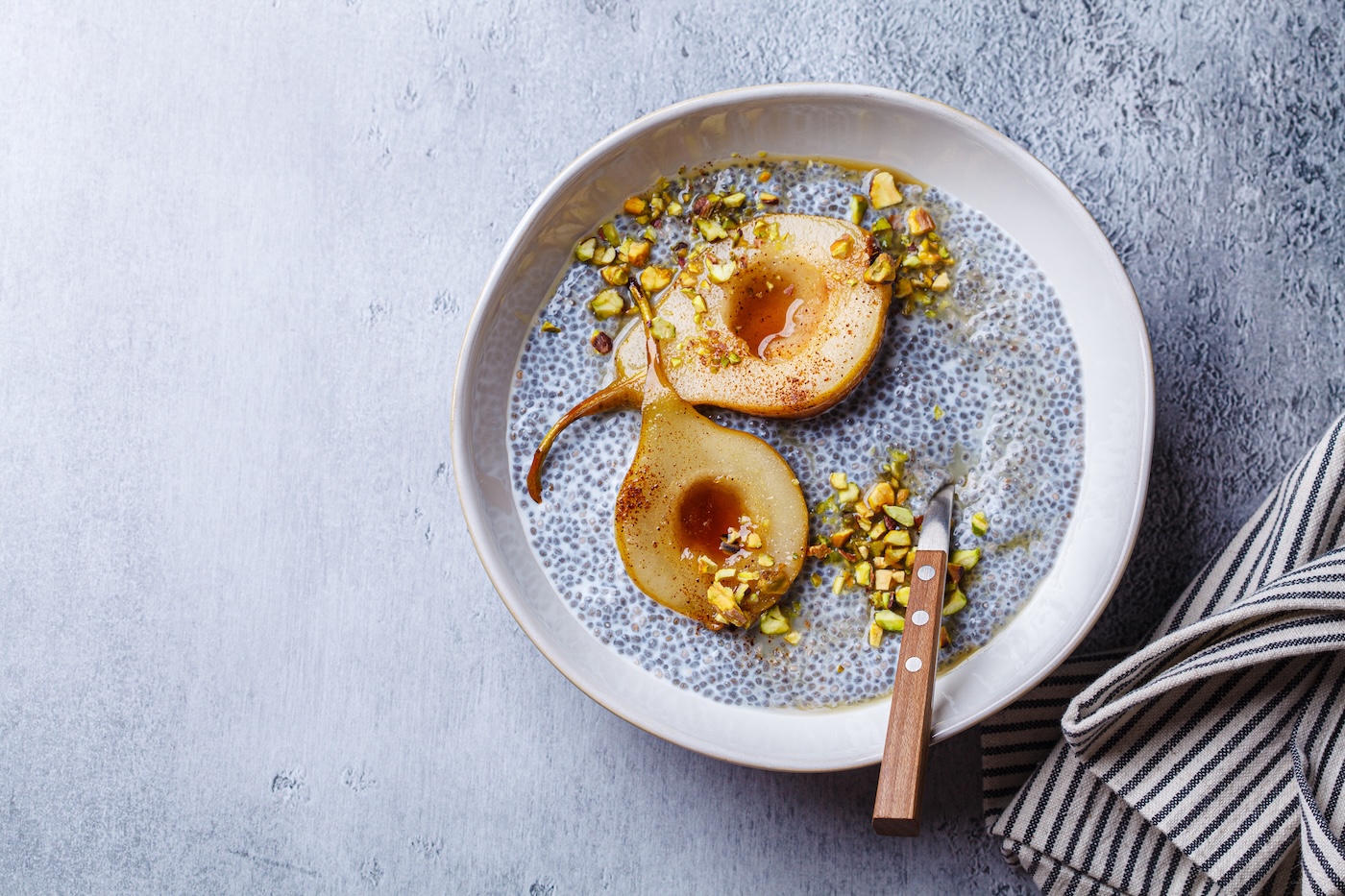 Chia pudding with caramelized pear and pistachio (vaaseenaa / Getty Images)