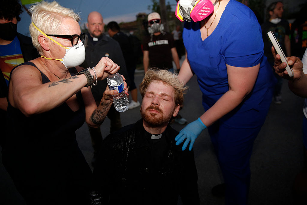 Faith leaders seem to be unusual targets for ICE during protests. However, pepper spray in the eyes, pepper balls to the head, physical assault and arrests are doing nothing to deter them. (OCTAVIO JONES / AFP via Getty Images)