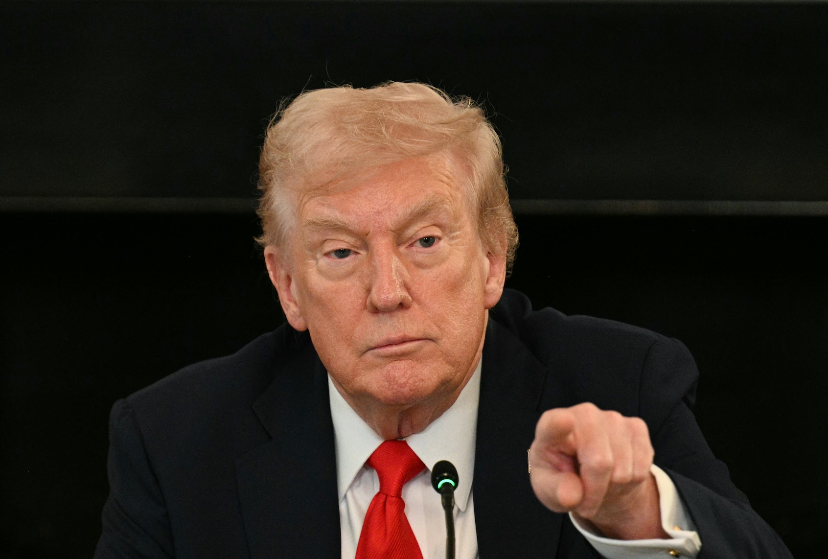 US President Donald Trump fields a question from a reporter during a roundtable about Antifa in the State Dining Room of the White House in Washington, DC, on October 8, 2025. (Photo by Jim WATSON / AFP)