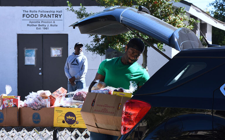 Local community food banks saw long lines of people needing assistance this week as SNAP benefits might be cut this month. While these Floridians got food, some politicians got dramatic. (Paul Hennessy/Anadolu via Getty Images)