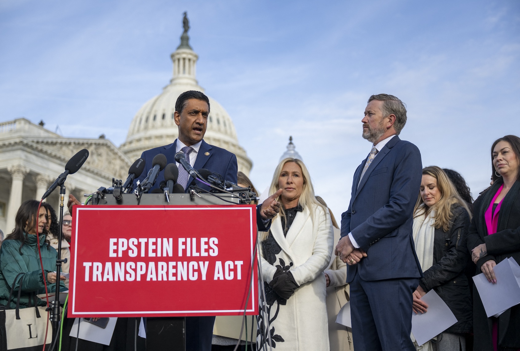 Rep. Ro Khanna (D-CA) speaks alongside Rep. Marjorie Taylor Greene (R-GA) (C) and Rep. Thomas Massie (R-KY) (R) during a news conference on the Epstein Files Transparency Act at the US Capitol in Washington, DC, on November 18, 2025. US lawmakers are expected to vote Tuesday for the release of government records on sex offender Jeffrey Epstein, in defiance of President Donald Trump's attempts to keep a lid on one of the country's most notorious scandals. (Photo by DANIEL HEUER / AFP)