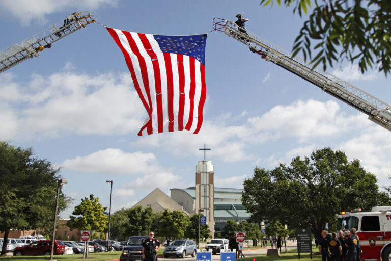 U.S. flag hangs over a church in Plano, Texas. (Photo by Stewart  F. House/Getty Images)