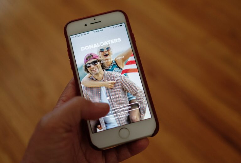 A person looks at DonaldDaters, a dating app for Trump supporters (CHRIS DELMAS/AFP via Getty Images)