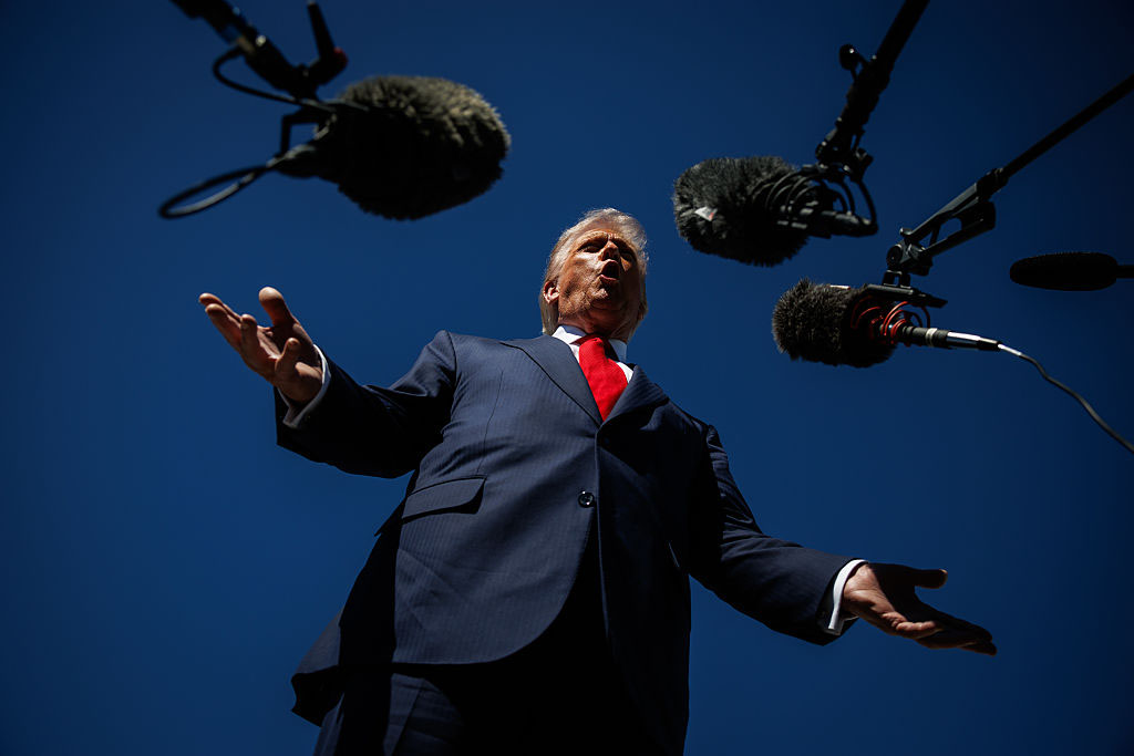 US President Donald Trump speaks to reporters as he arrives at Palm Beach International Airport on October 31, 2025 in West Palm Beach, Florida. (Samuel Corum/Getty Images)