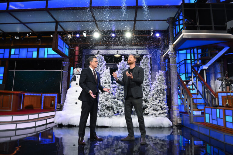 Prince Harry (R) crashes Stephen Colbert's monologue for political jabs and a role in a Christmas movie. (Scott Kowalchyk courtesy of CBS Broadcasting Inc.)