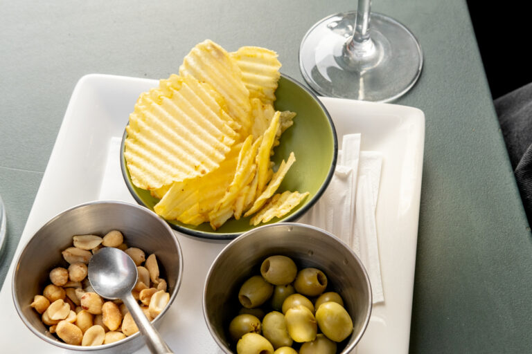 Chips, olives and salted peanuts (Elena Noviello/Getty Images)