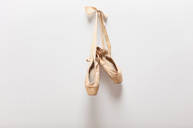 Pair of old ballet shoes hanging on a wall (ljupco / Getty Images)