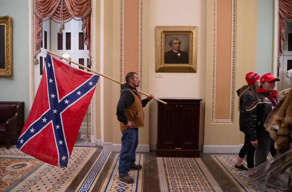The pardon of the January 6 insurrectionists echoed the 1868 pardon of Confederate soldiers. The effects include the meld of Confederate values with the far right politics of today. (SAUL LOEB / Getty Images)