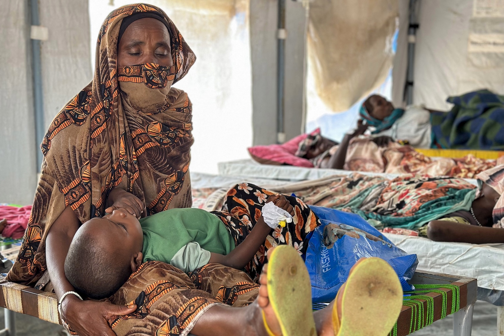 Cholera infected patients receive treatment in the cholera isolation centre at the refugee camps of western Sudan, in Tawila city in Darfur, on August 14, 2025. (AFP/Getty Images)