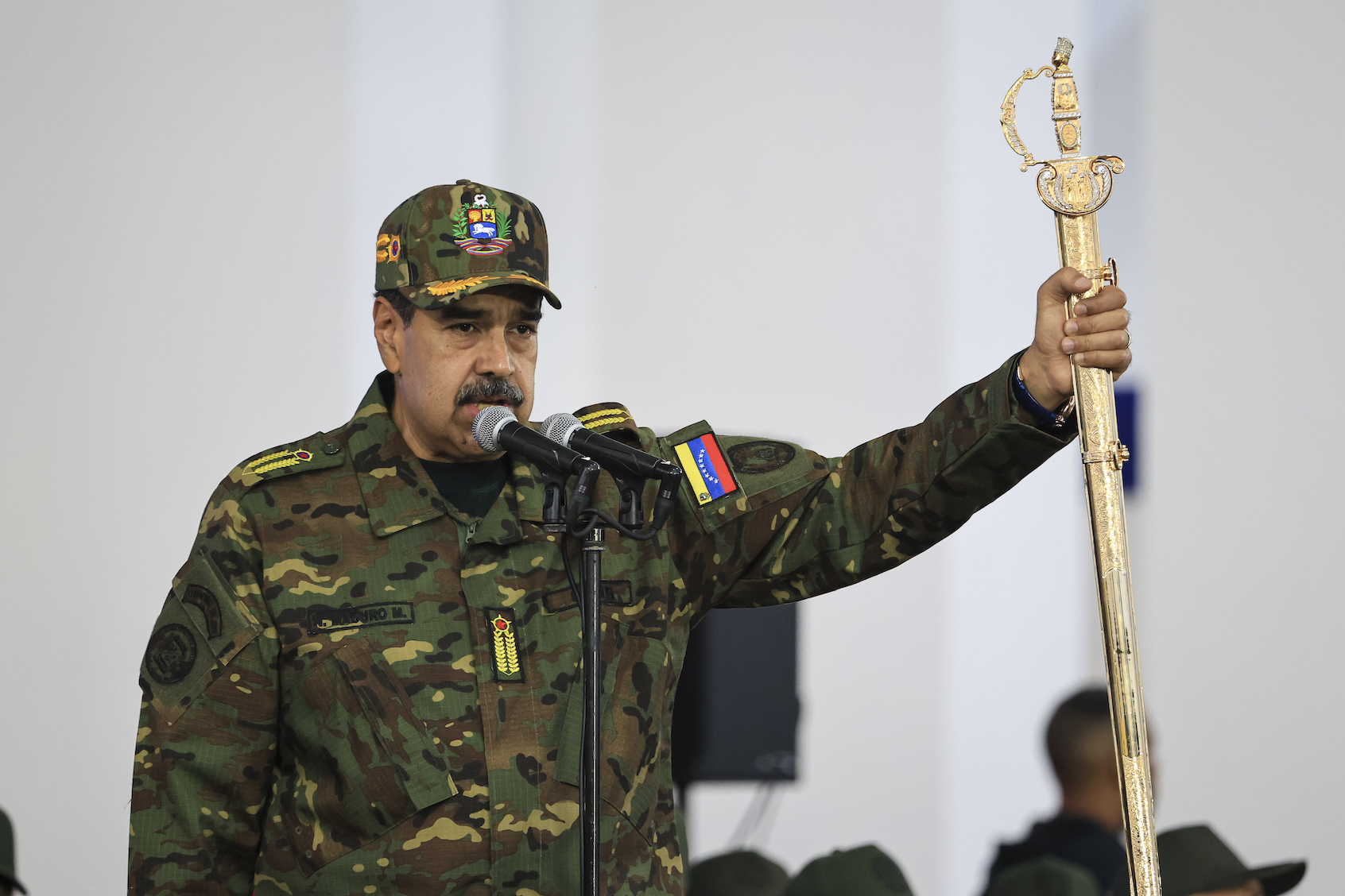 President of Venezuela Nicolás Maduro delivers a speech while holding the Venezuelan independence hero Simon Bolivar's 'Sword of Peru' during a military ceremony on November 25, 2025, in Caracas, Venezuela. The United States recently designated the "Cartel De Los Soles" (Cartel of The Suns) as a foreign terrorist organization, a group allegedly led by the president of Venezuela, Nicolas Maduro, and which, it is presumed, includes high-ranking members of the Venezuelan government. ((Photo by Jesus Vargas/Getty Images))