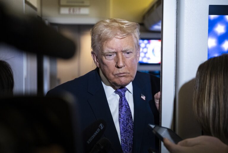 NOVEMBER 30: ABOARD AIR FORCE ONE President Donald Trump speaks to the press aboard Air Force One en-route to Washington, DC on November 30, 2025. The first family is returning to Washington, DC after spending the Thanksgiving holiday weekend at his Mar-A-Lago Resort In Florida.  (Photo by Pete Marovich/Getty Images)