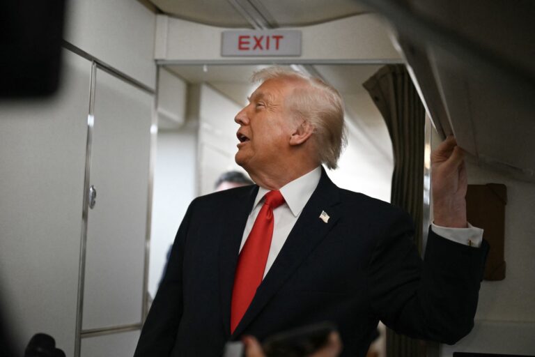 US President Donald Trump speaks to the media aboard Air Force One on December 9, 2025, en route to deliver remarks in Pennsylvania. ((Photo by Andrew Caballero-Reynolds/Getty Images)