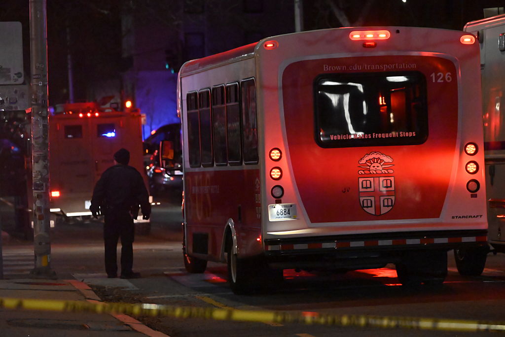 Authorities used Brown's own transportation to help evacuate students and staff to safer places during the campus lockdown after the shooting on Saturday. (Kyle Mazza / Getty Images)