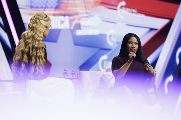 Erika Kirk interviews surprise guest Nicki Minaj on the final day of Turning Point USA's annual AmericaFest conference at the Phoenix Convention Center on December 21, 2025 in Phoenix, Arizona. Minaj spoke about her frustrations with California Governor Gavin Newsom, and about why she has embraced the conservative movement. (Photo by Caylo Seals/Getty Images)