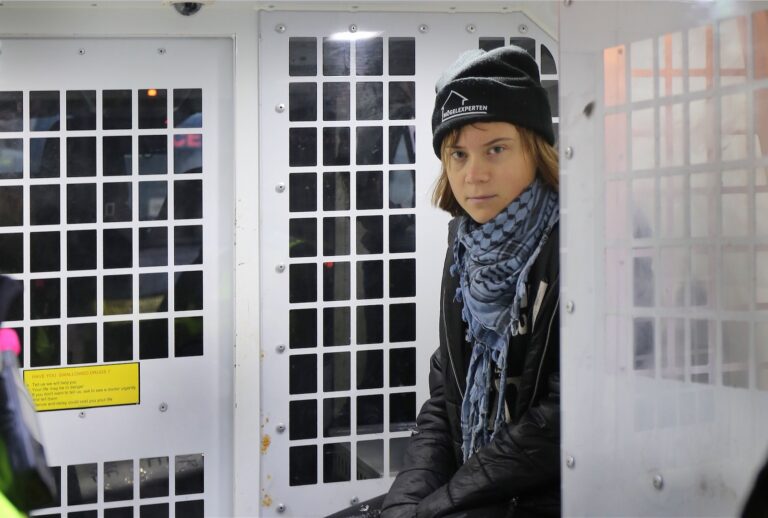 LONDON, ENGLAND - DECEMBER 23: Activist Greta Thunberg is arrested and sits in the back of a police van outside the offices of Aspen Insurance on December 23, 2025 in London, England. The activists targeted the company due to its alleged business relationship with the Israeli defence contractor Elbit Systems. They are also protesting in support of six of the so-called "Filton 24" prisoners who were arrested in 2024 and have been refusing food for over 50 days while being held on remand ahead of a trial. (Photo by Martin Pope/Getty Images)