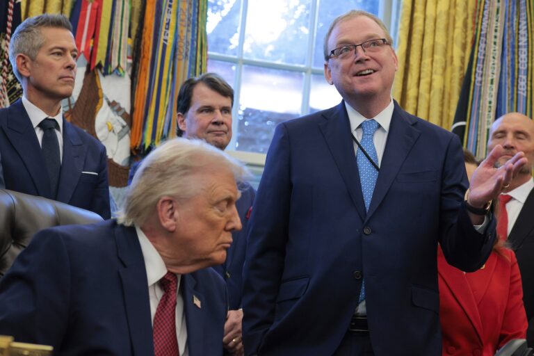 Director of the National Economic Council Kevin Hassett (right) speaks as President Trump makes an announcement on changes to the country's fuel economy standards in the Oval Office, Dec. 3, 2025. (Chip Somodevilla/Getty Images)