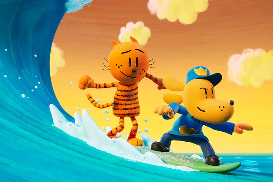 Animated still of an orange striped cat and a dog in a police uniform balance on the same surfboard as it rides a giant blue cresting wave. The sky is yellow-orange behind them