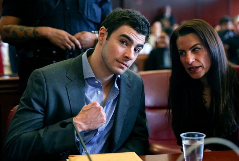 Luigi Mangione appears with his lawyers for a suppression-of-evidence hearing in the killing of UnitedHealthcare CEO Brian Thompson in Manhattan Criminal Court on Dec. 8, 2025, in New York City. (Sarah Yenesel - Pool/Getty Images)